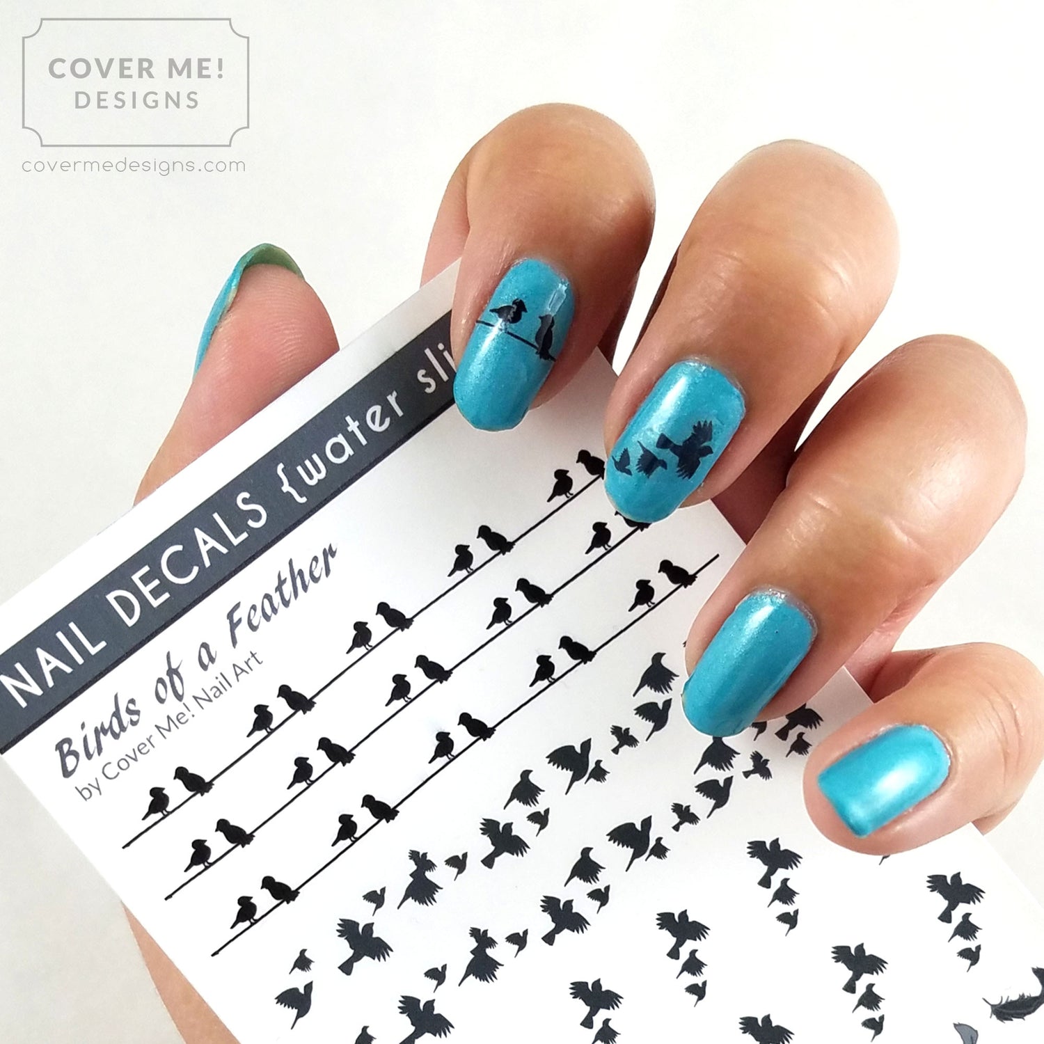 blue nails with black bird nail art decals