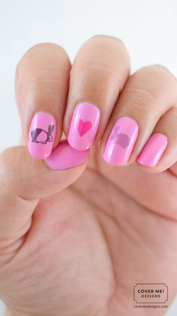 pink nails with bunny and heart nail decals