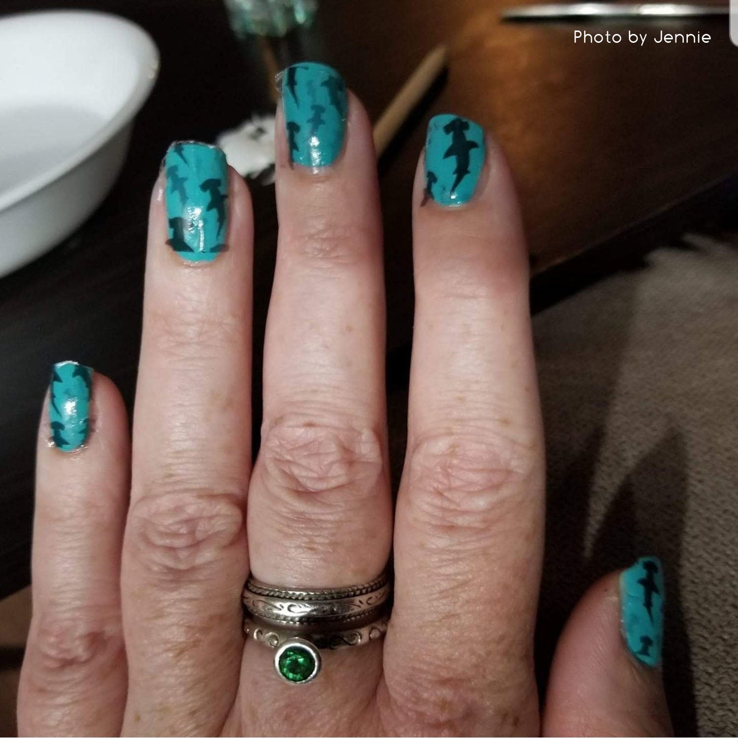 Hammerhead sharks on blue nail polish nail art