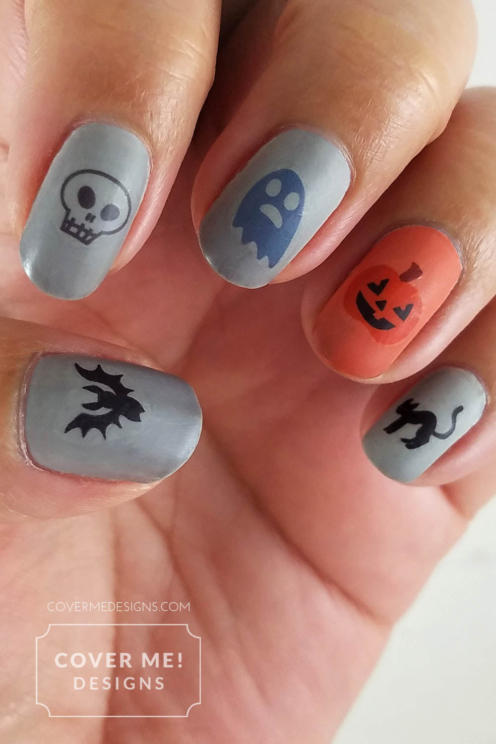 happy halloween nail art decals orange and gray manicure with bats, skulls, ghosts, pumpkins, and black cats