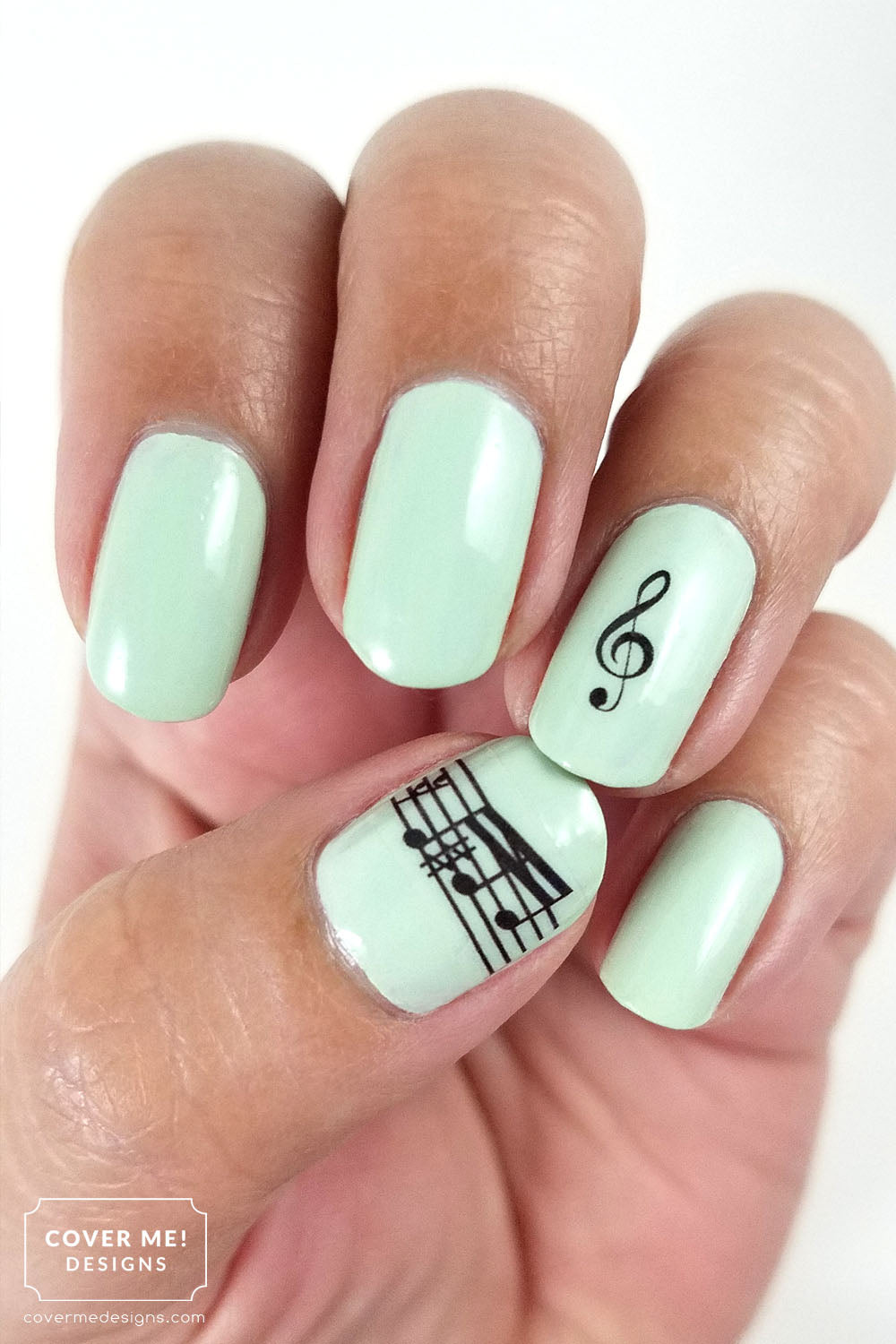 Mint green nail art with music bar nail decals