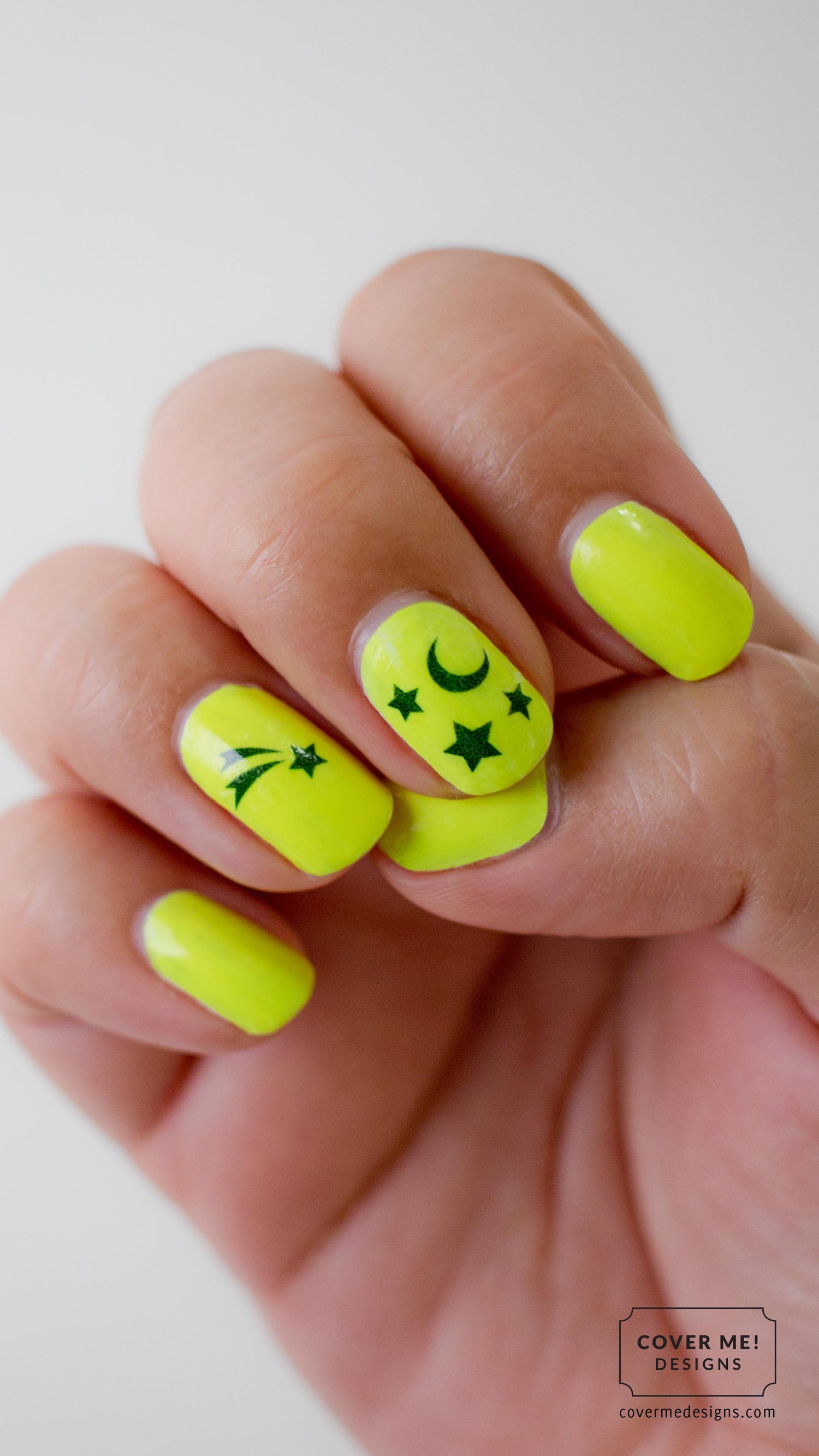 Bright yellow neon nail polish with star and moon nail stickers