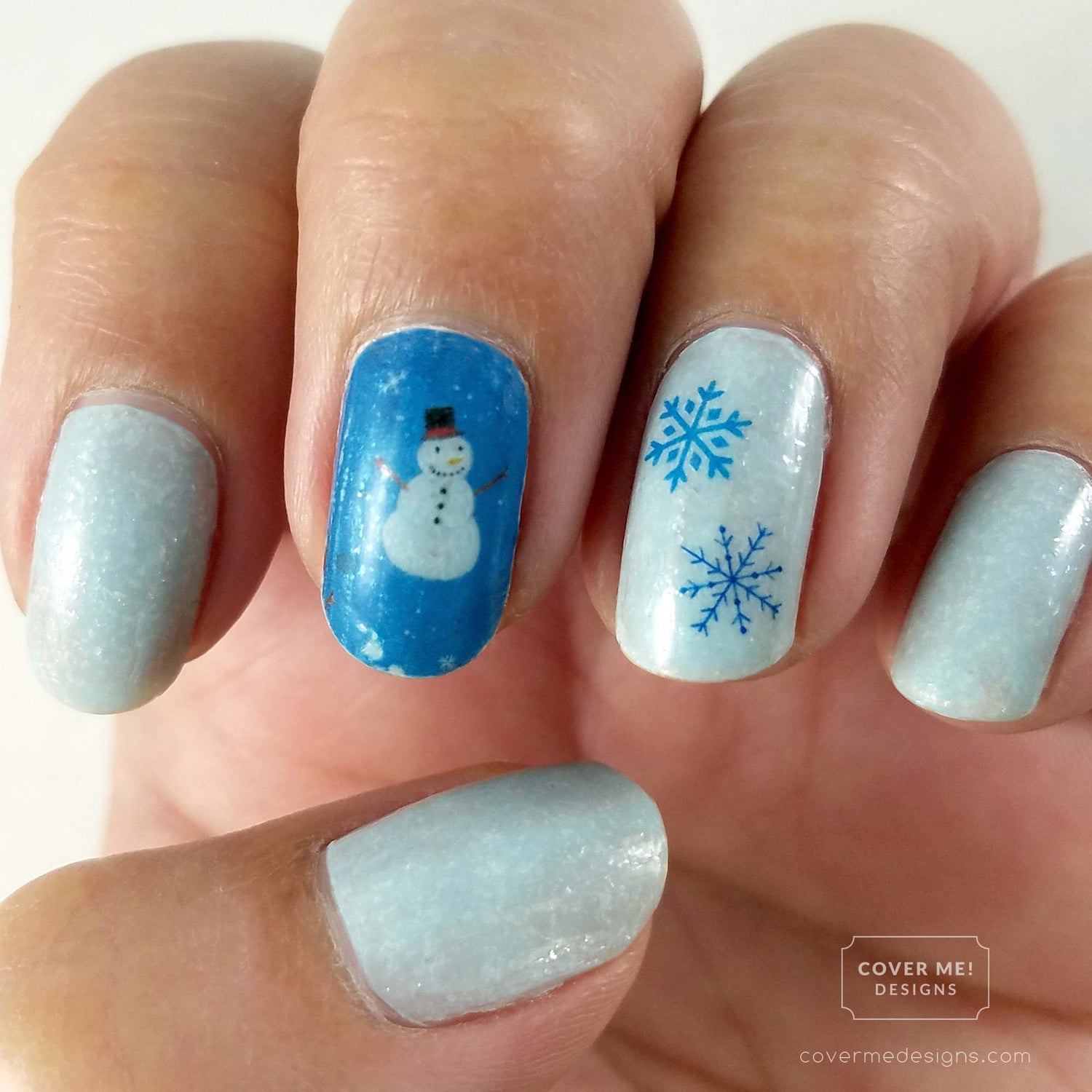 Ice blue winter nail art with snowman and snowflake nail stickers