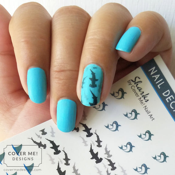 hammerhead shark nail art decals on bright blue nail polish